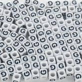 BD00118-02-black-letter-white-opaque-cube-alphabet-beads-single-g-7mm
